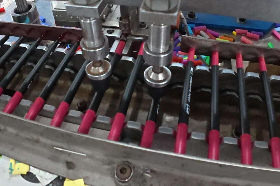 Marker assembly fixtures in a stationery workshop